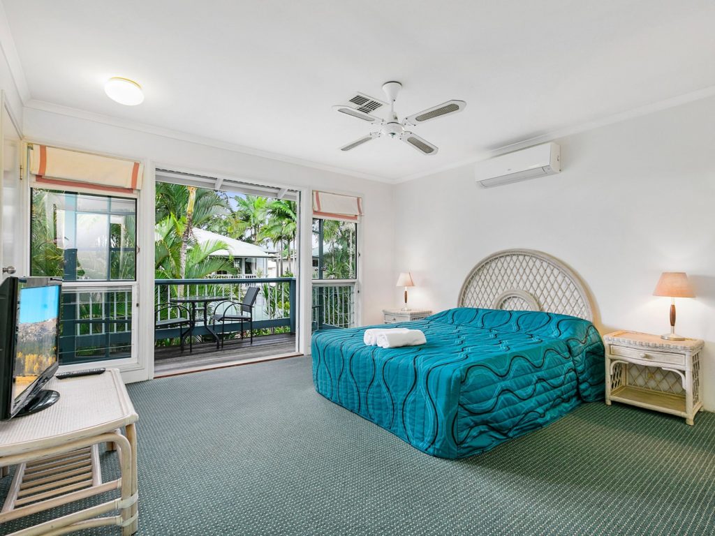Large queen bedrooms with balconies at Coral Beach Noosa Resort