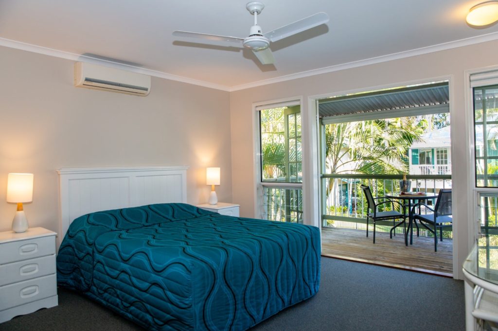Main bedroom opening up onto the tropical views of Coral Beach Noosa Resort